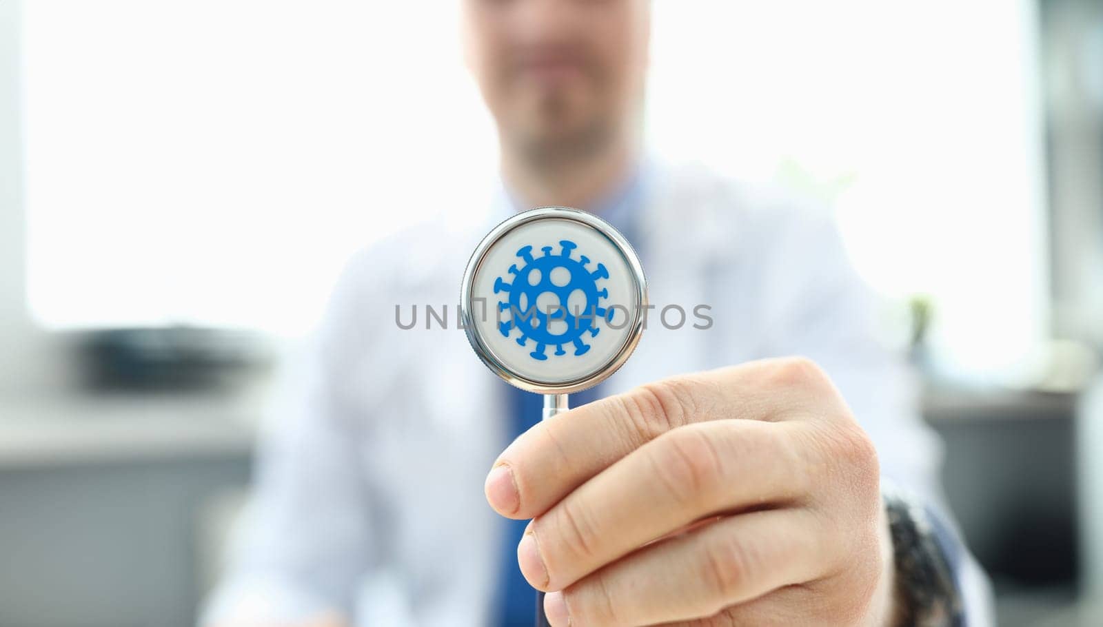 Doctor holds stethoscope infected with coronavirus. Fast-growing healthcare segment. Reduce number trips to doctor thanks to telemedicine. Determining prognosis disease during pandemic