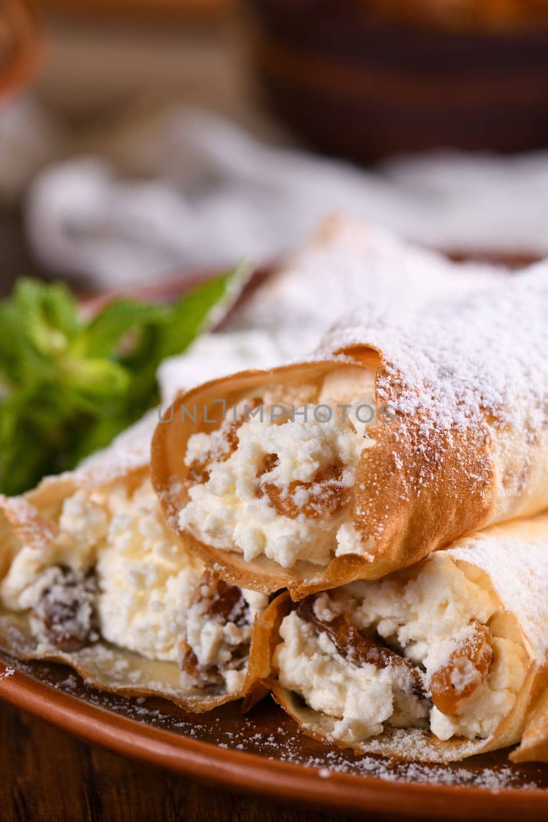 Thin pancakes stuffed with cottage cheese, honey and raisins by Apolonia