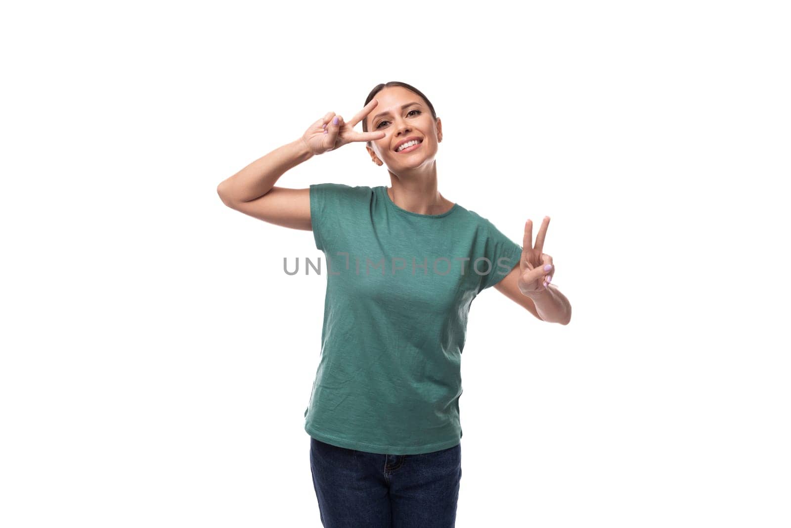 young confident slim woman dressed in a green basic t-shirt with print mockup. corporate clothing concept by TRMK