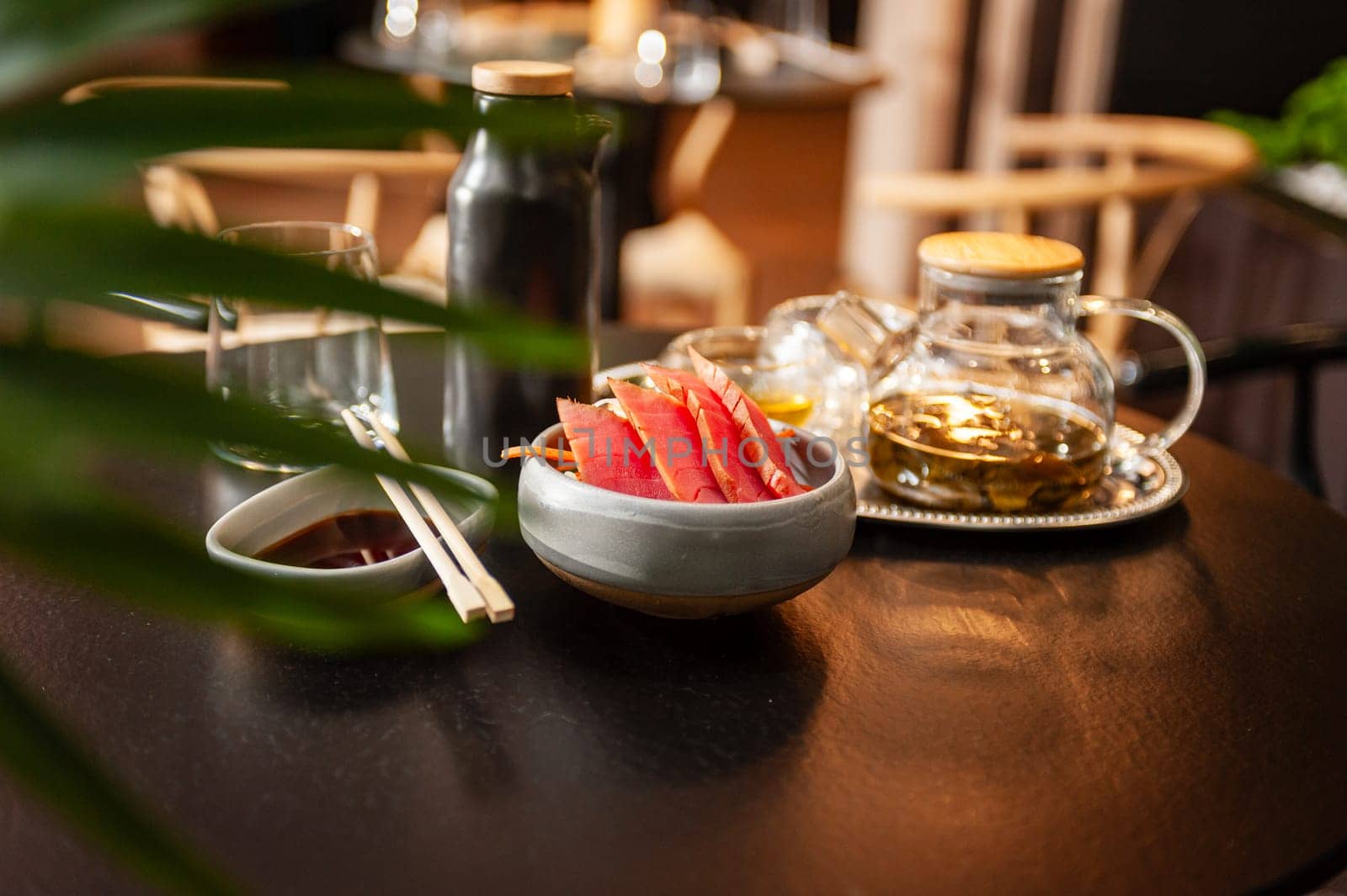 Tuna sashimi on a plate on a table in a sushi bar on a plate close-up. High quality photo