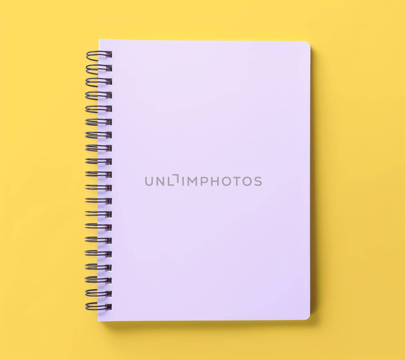 Blank Notepad on Blue Desk: Minimalistic Office Inspiration with White Spiral Notebook on Pastel Table Top by Vichizh