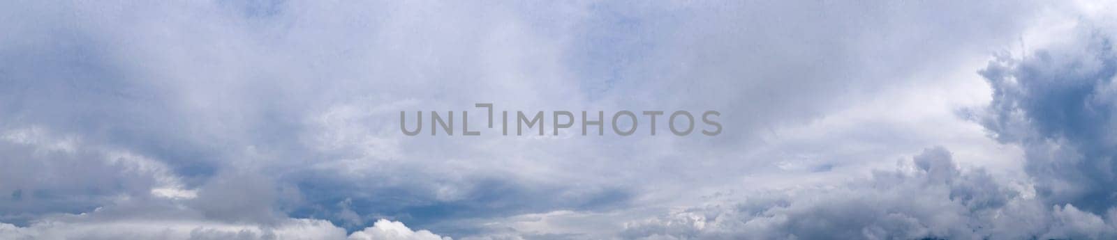 Panoramic view of blue sky with stormy clouds 