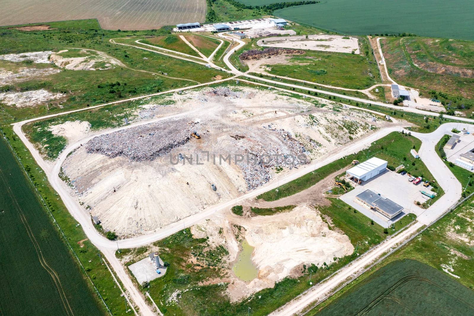 Aerial top view of a city garbage dump. Waste Disposal Facility by EdVal