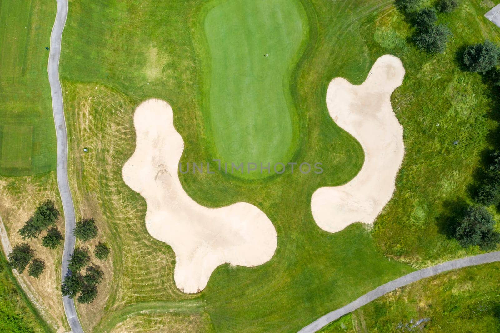 Landscape in a golf course an aerial view of a green field, lawn, and grass. Design for golfers to play games, sports, and outdoor recreation activities. by EdVal