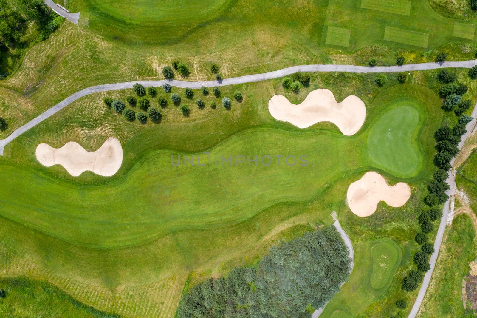 Landscape in a golf course an aerial view of a green field, lawn, and grass. Design for golfers to play games, sports, and outdoor recreation activities.