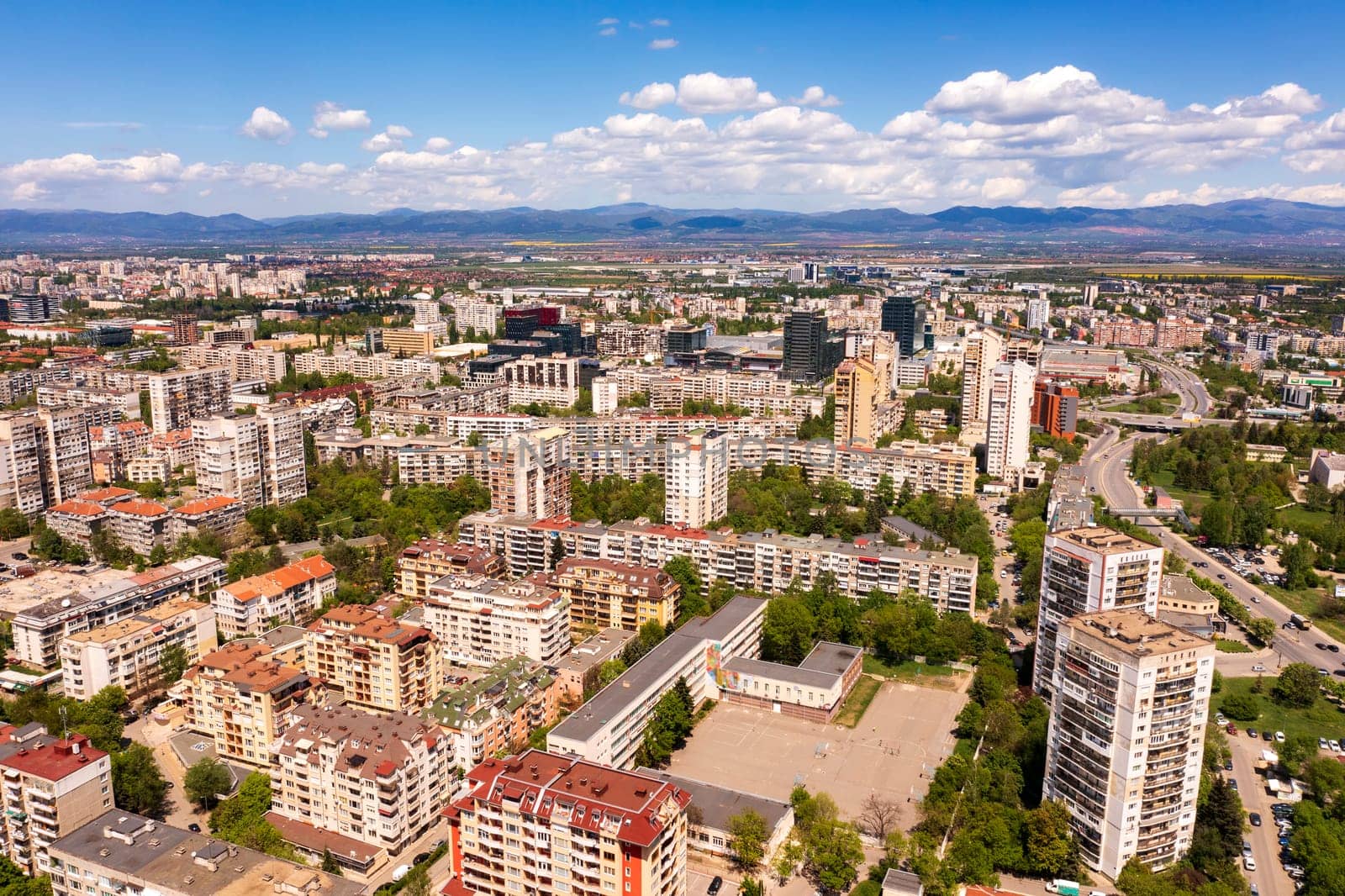 Aerial view from a drone of a district of the city next to the mountain, Sofia Bulgaria by EdVal