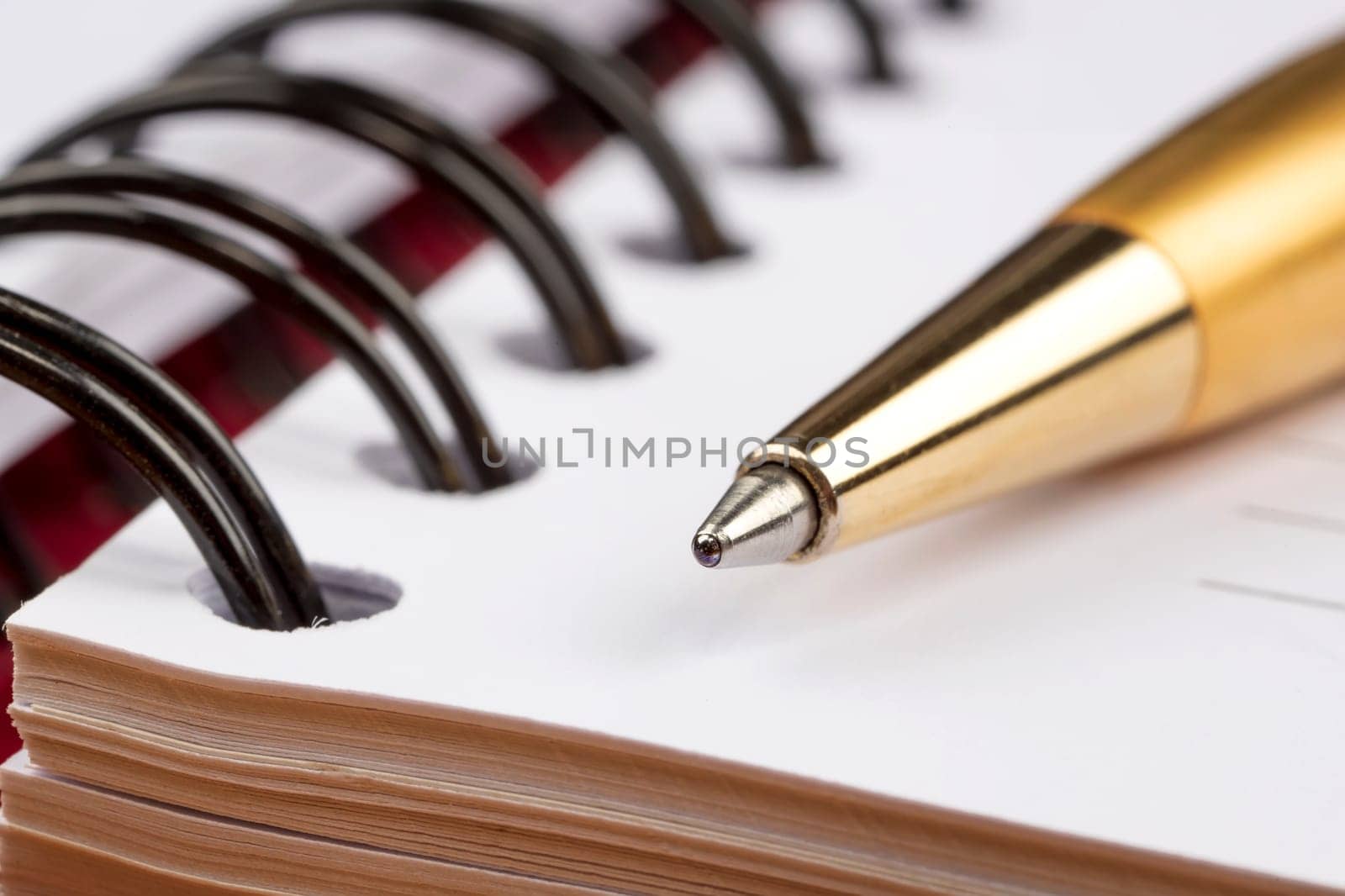 notebook and luxury pen close up with a blurred background  by EdVal