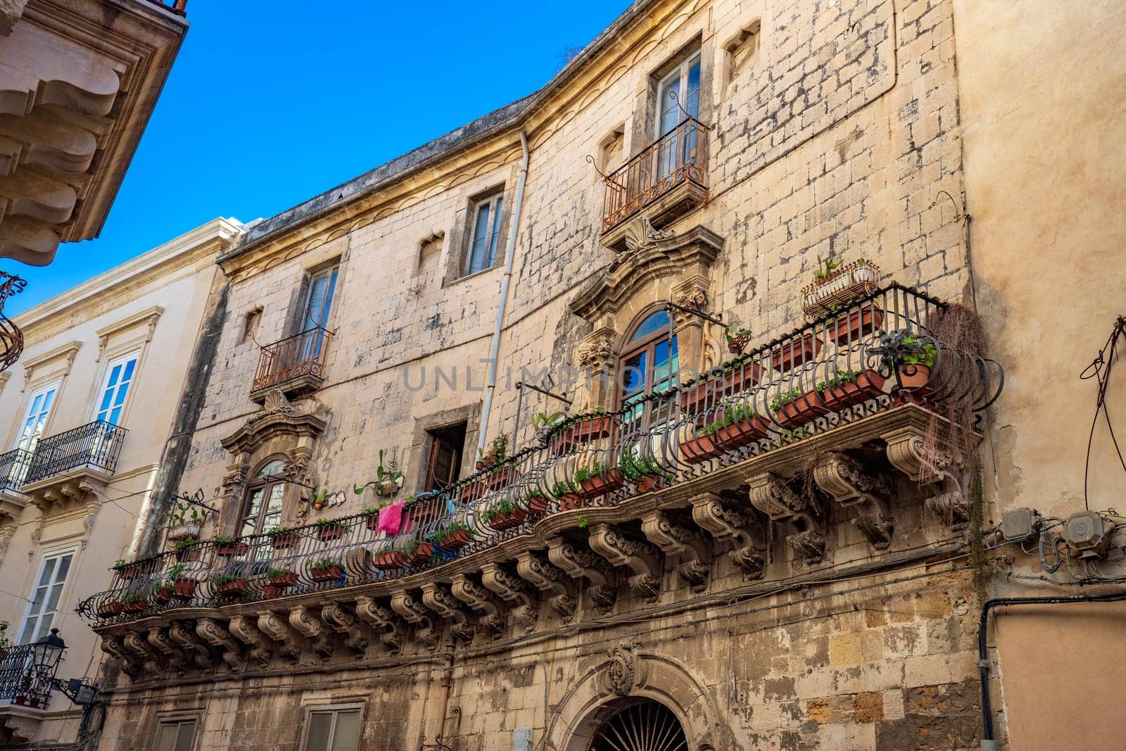 Sicily. One of the spectacular balconies in the city is an example of the Sicilian baroque style.