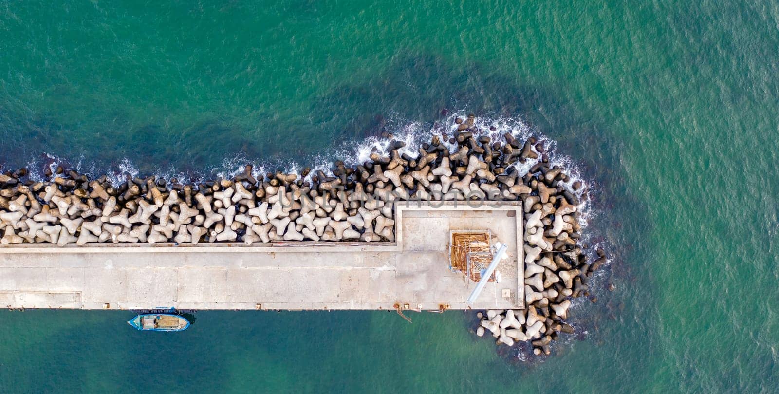Aerial panoramic view from drone to the breakwater and pier by EdVal