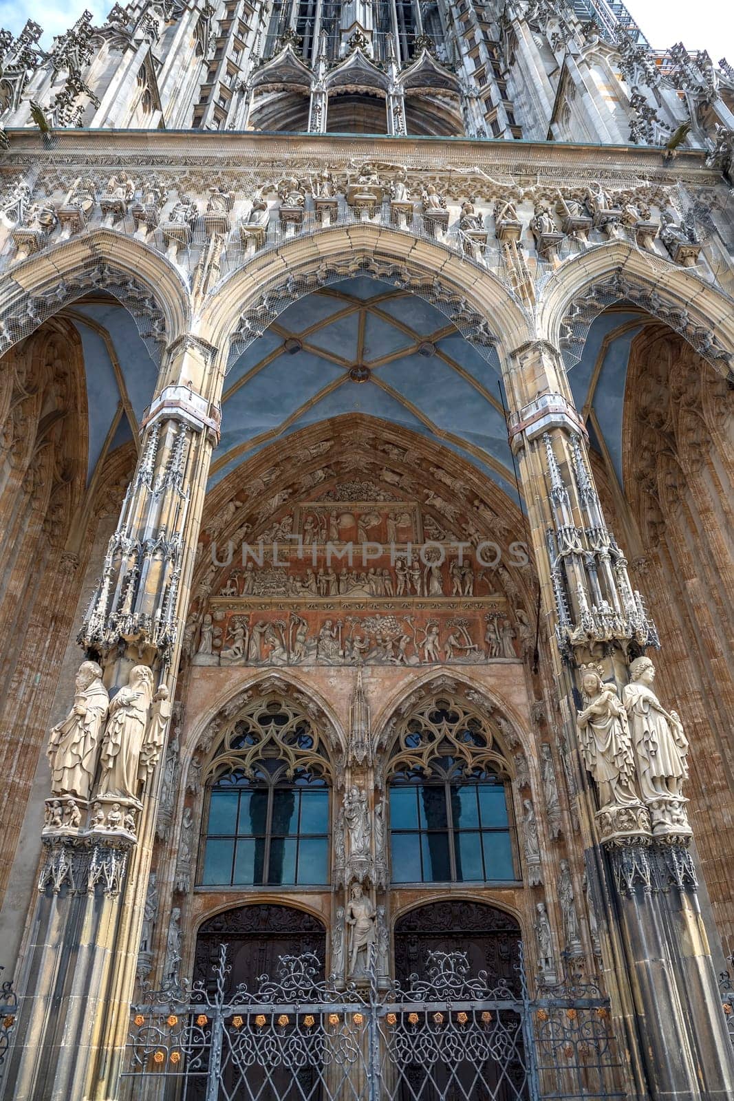 Ornate facade of famous medieval architecture, detail. The main gate of Ulm Cathedral by EdVal