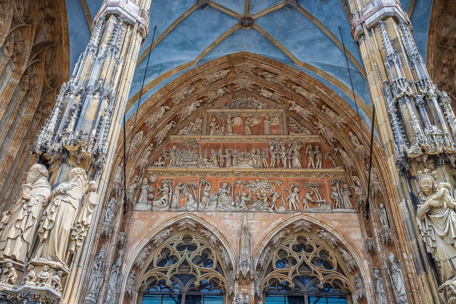 Ornate facade of famous medieval architecture, detail. The main gate of Ulm Cathedral by EdVal