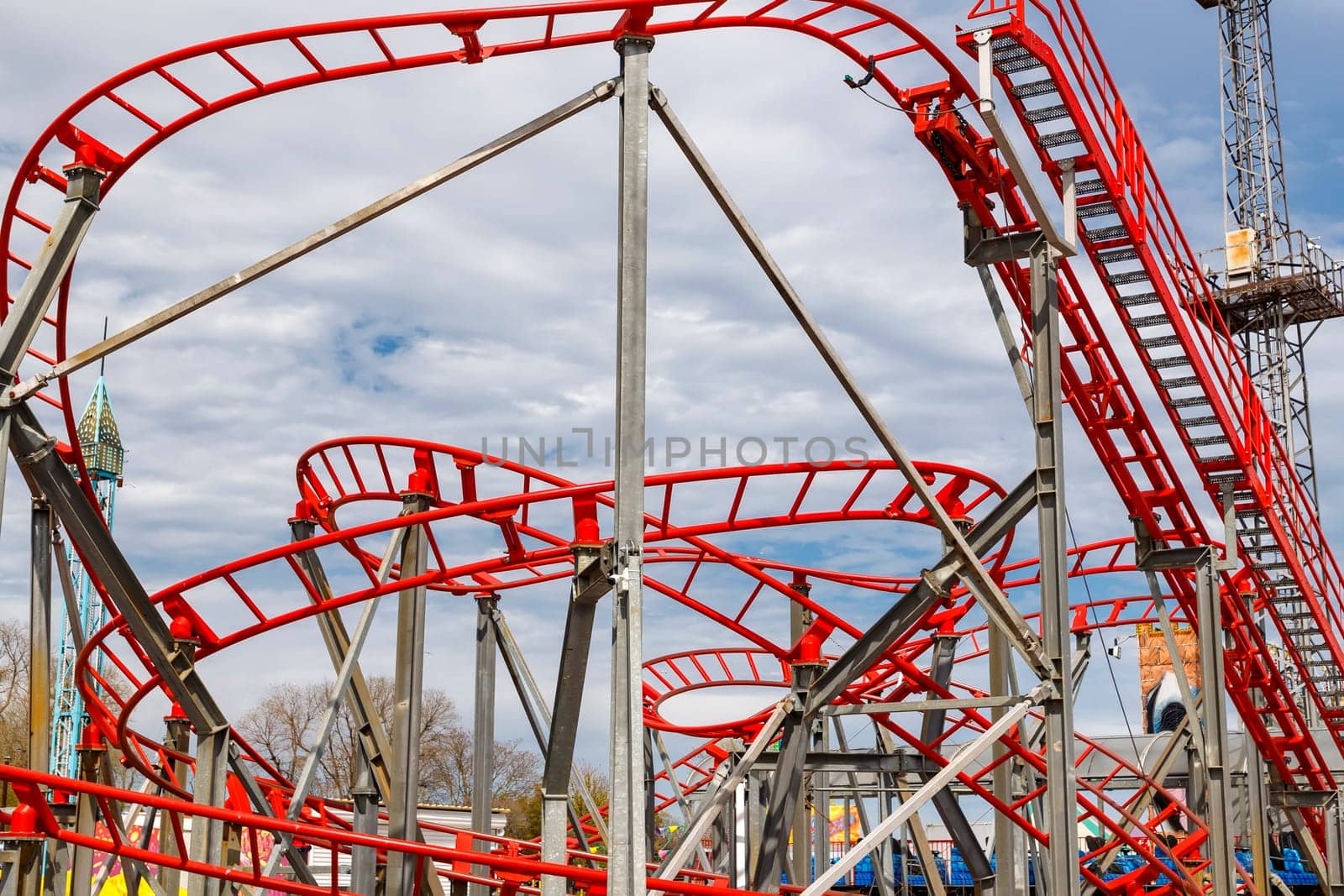 a part of a looping  roller coaster in an amusement park by EdVal