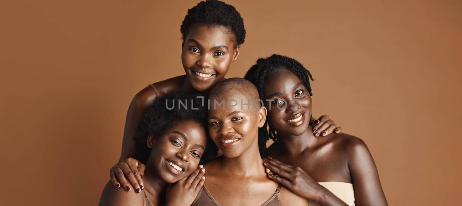 Face, beauty and happy black woman friends in studio on a brown background for natural wellness. Portrait, skincare and smile with a group of people together for an antiaging treatment routine by YuriArcurs