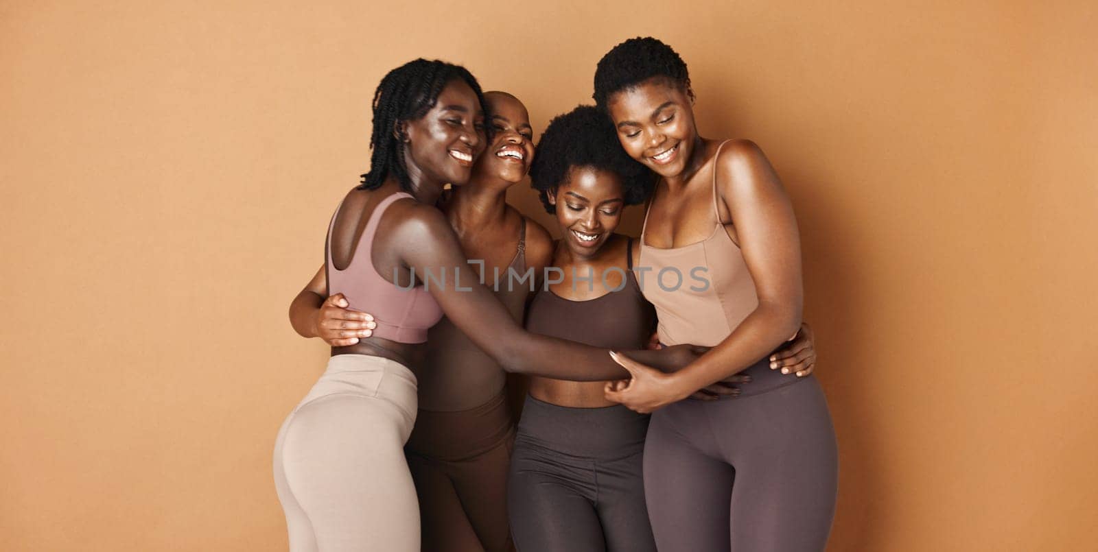 Hug, face or African models with skincare, glowing skin or results isolated on brown background. Facial dermatology, friends or natural beauty cosmetics in studio with black women or happy people by YuriArcurs