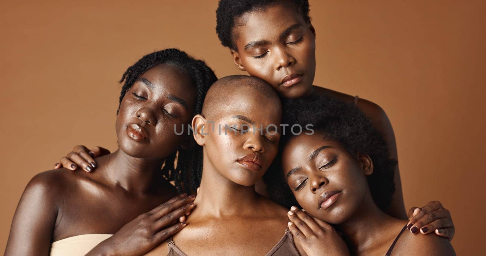 Skincare, beauty and face of black women in studio with glowing, natural and facial routine. Smile, cosmetic and portrait of African female friends with dermatology face treatment by brown background by YuriArcurs