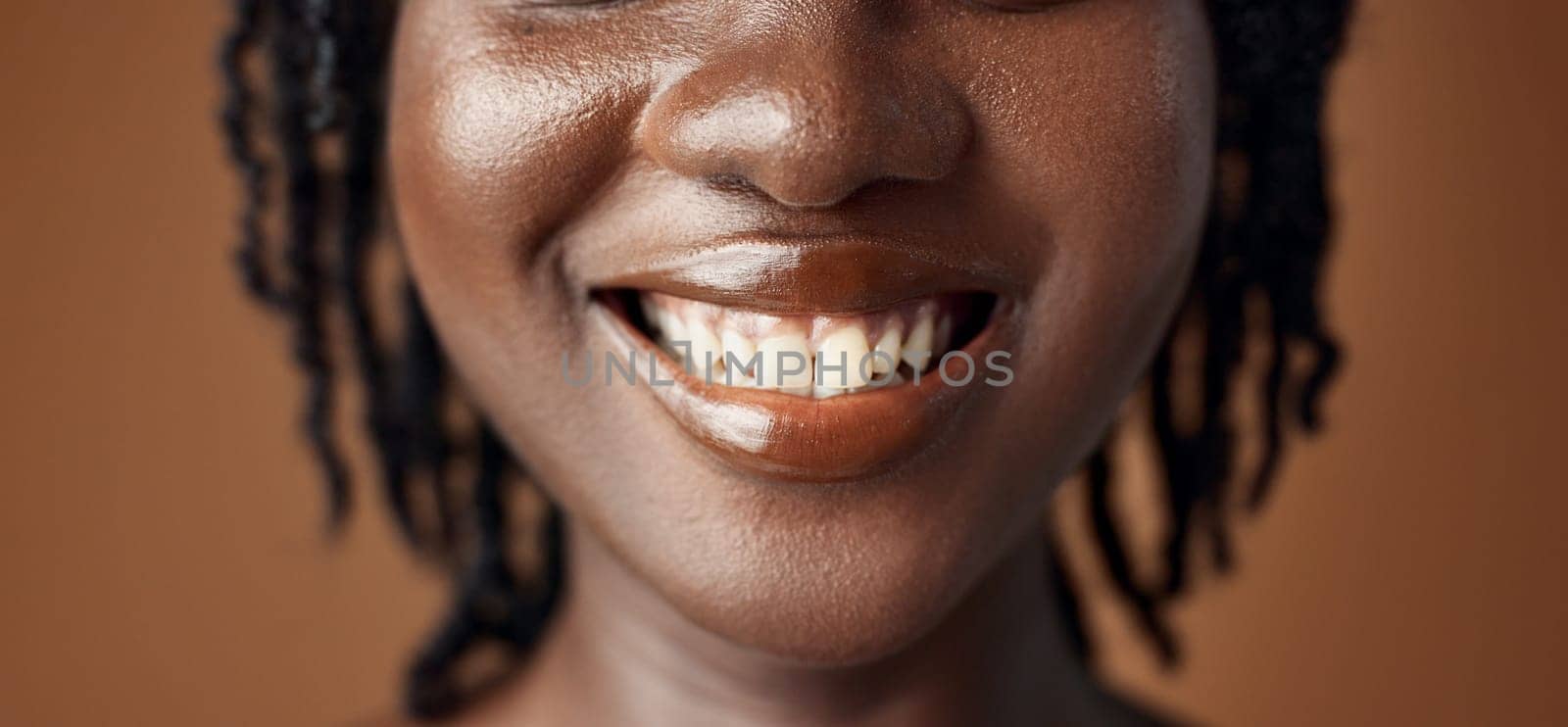Woman, teeth closeup or smile for dental care, oral hygiene or healthy wellness on brown background. Mouth, lips or face of a happy model in studio for tooth whitening, beauty or dentist treatment.