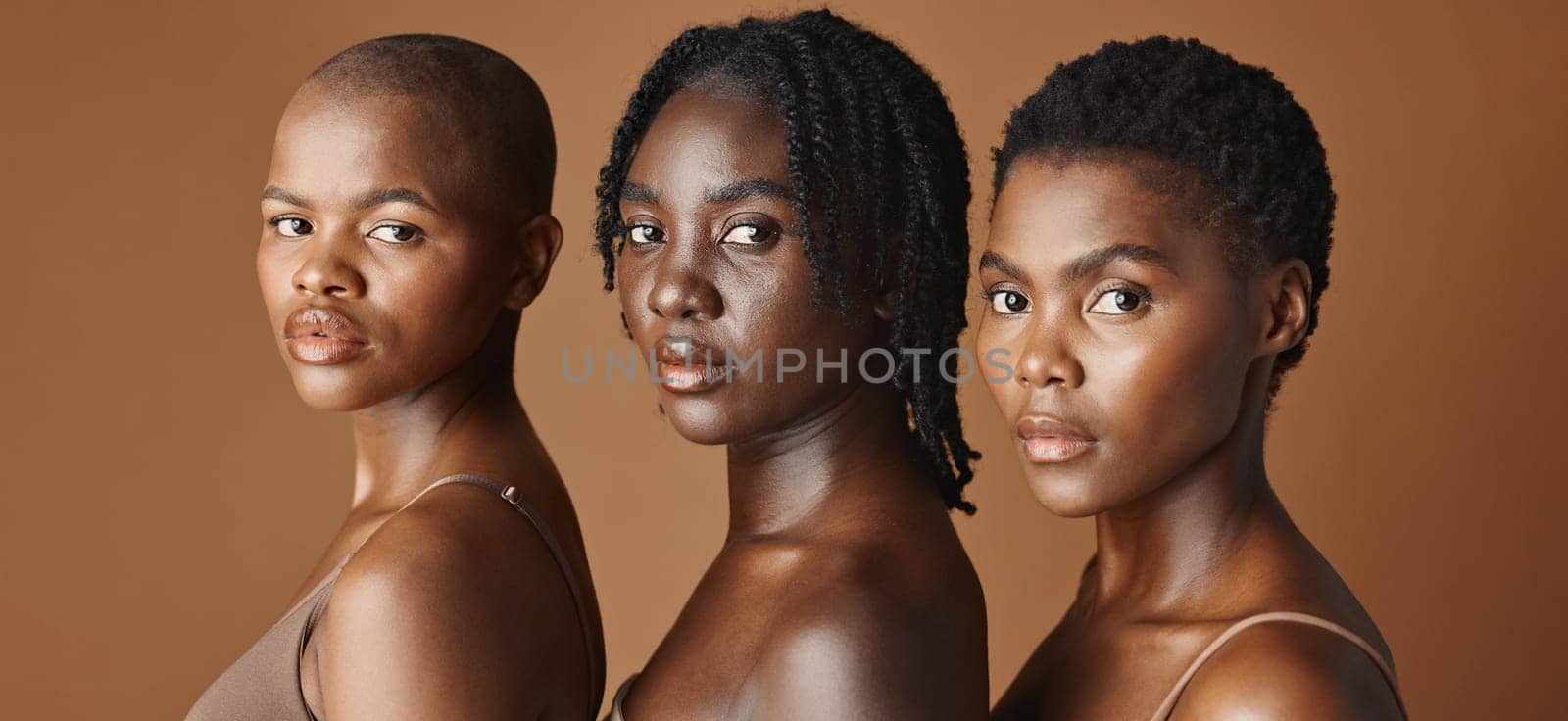 Beauty, face or black women models with glowing skin or afro isolated on brown background. Facial dermatology, diversity or skincare cosmetics for makeup in studio with girl friends or African people.