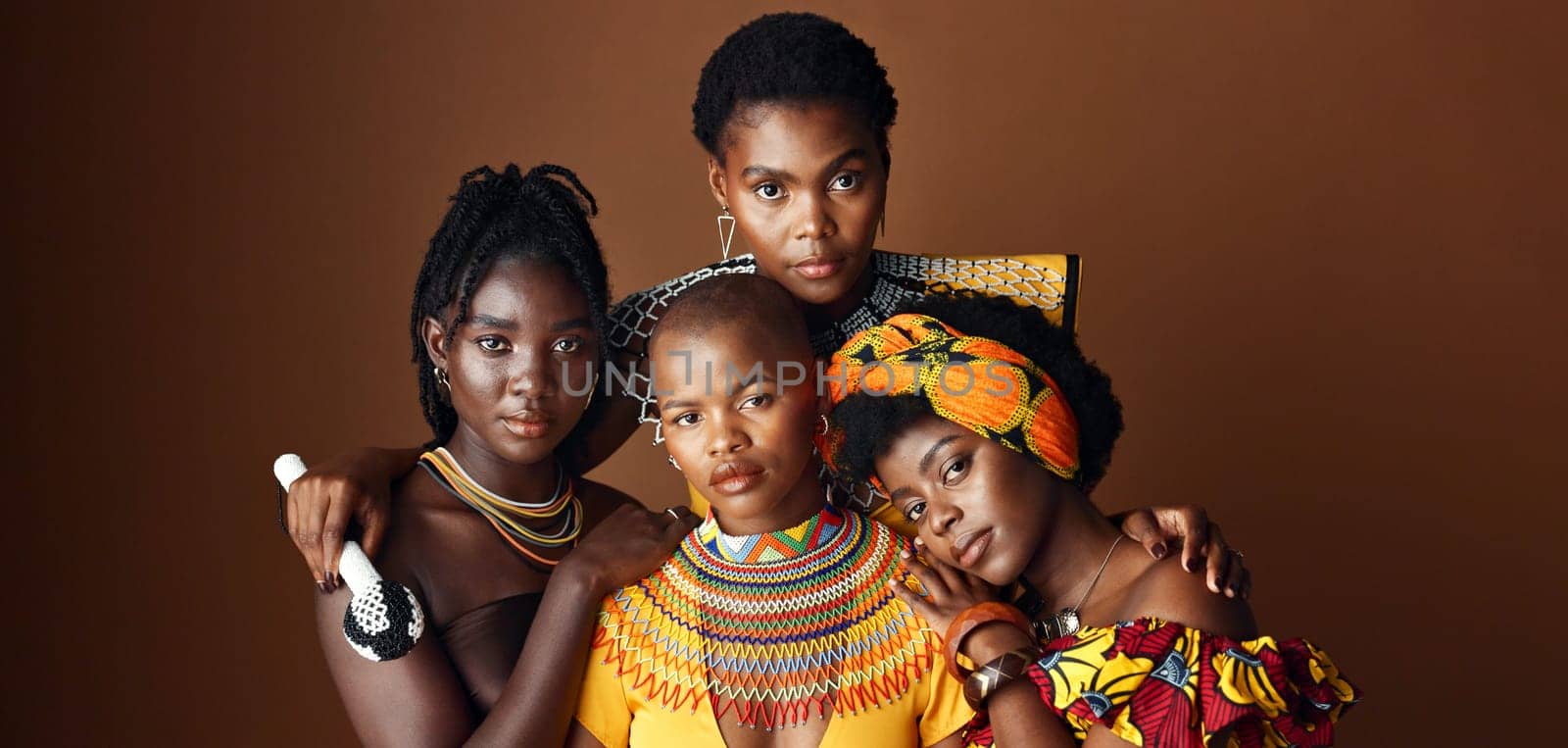 African women, group and studio for culture with face, jewelry or beads necklace in clothes by background. Black people, model and indigenous fashion for friends, traditional or portrait for kwanzaa.