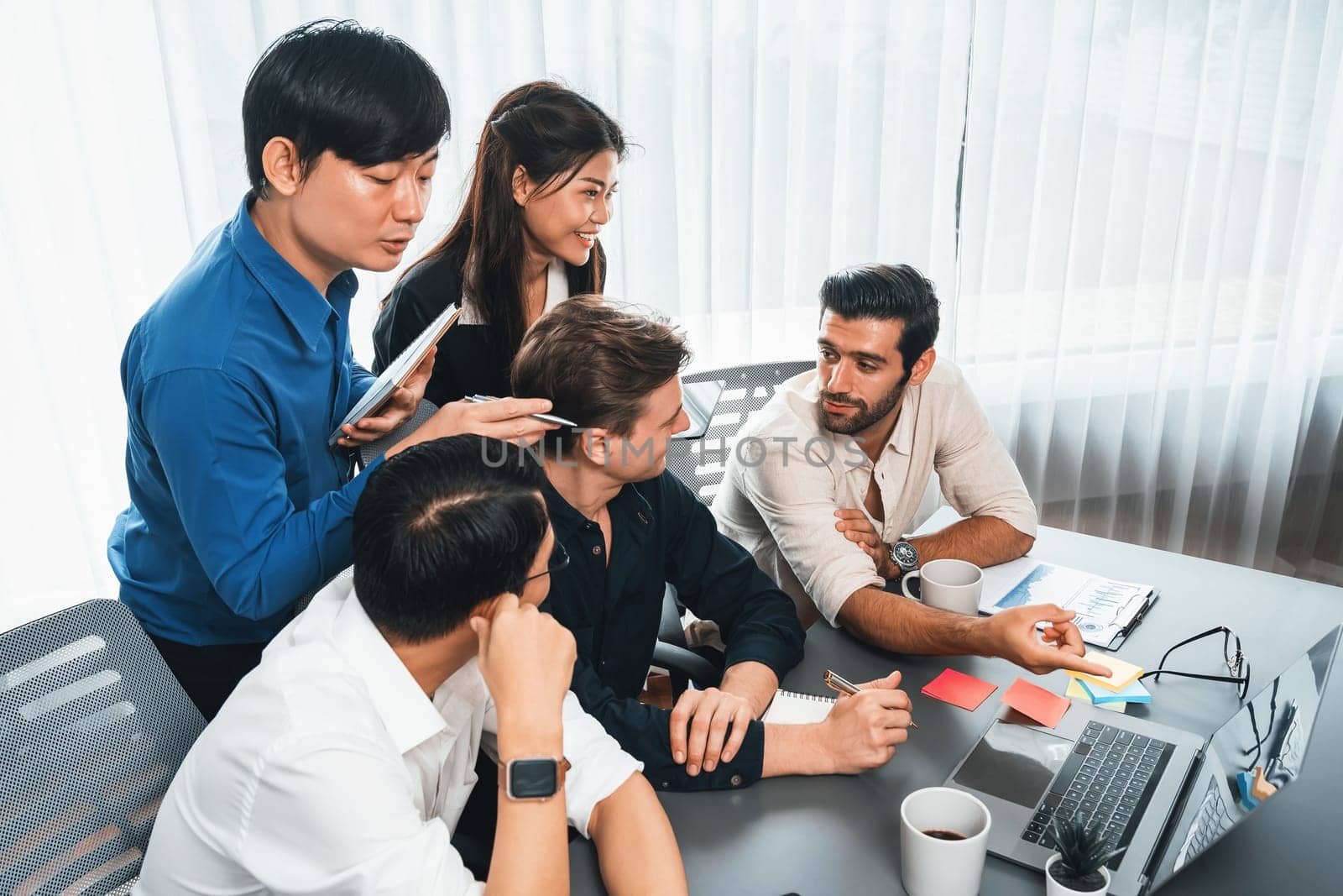 Group of diverse office worker employee working together on strategic business marketing planning in corporate office room. Positive teamwork in business workplace concept. Prudent