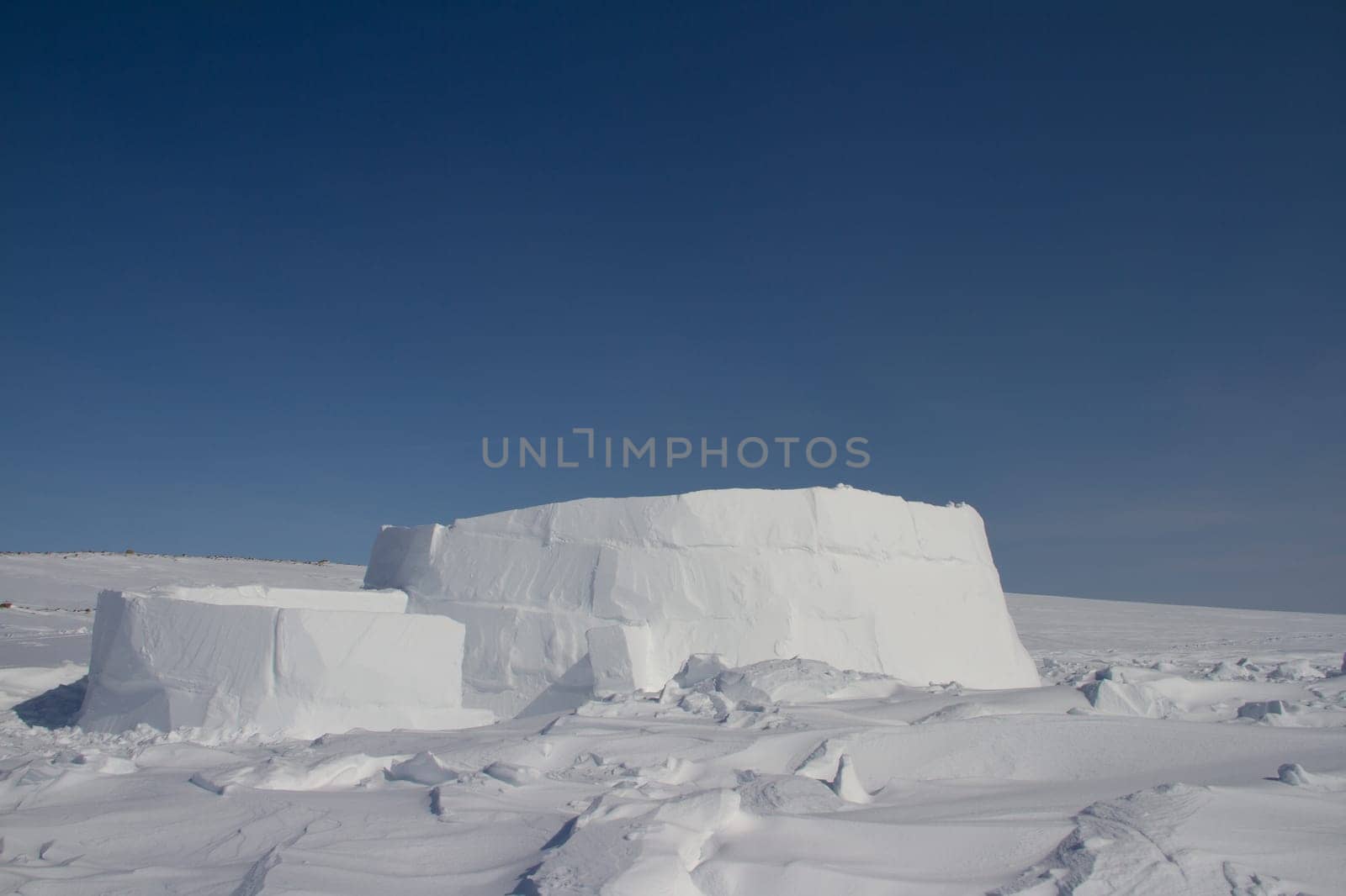 The beginnings of an igloo, a snow shelter from the harsh winter elements. Near Arviat, Nunavut, Canada