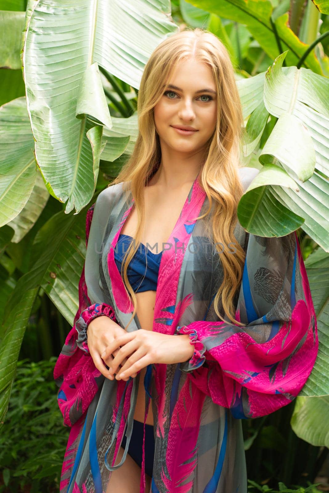 Beautiful young woman wearing summer clothes on tropical resort by OleksandrLipko