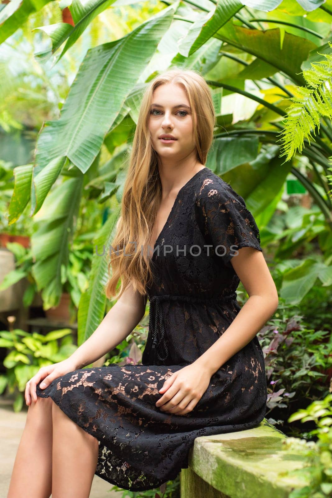 Beautiful young woman wearing summer clothes on tropical resort by OleksandrLipko