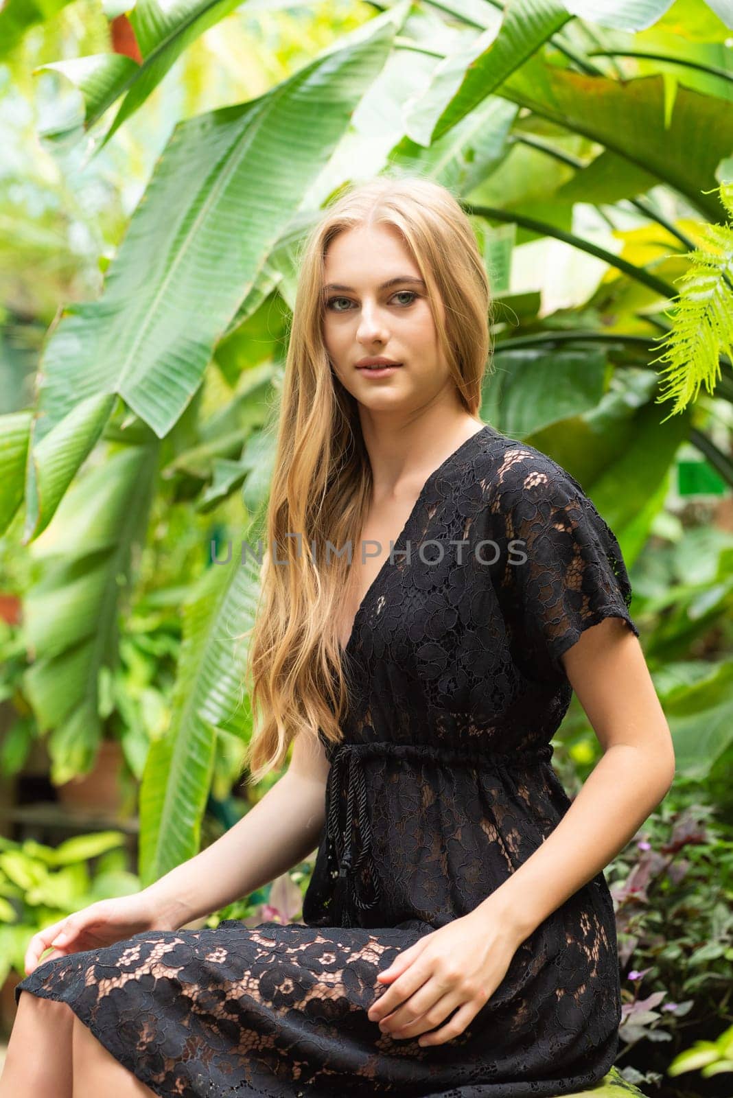 Beautiful young woman wearing summer clothes on tropical resort by OleksandrLipko