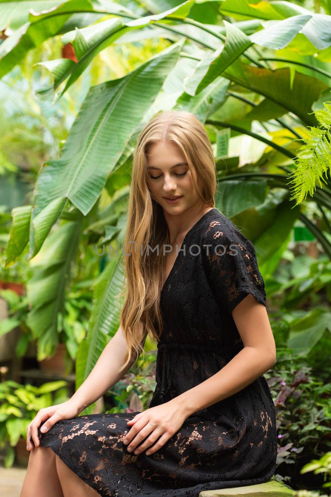 Beautiful young woman wearing summer clothes on tropical resort by OleksandrLipko