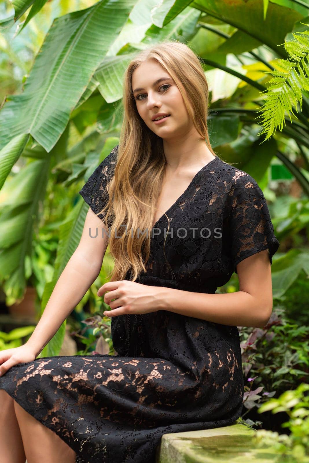 Beautiful young woman wearing summer clothes on tropical resort by OleksandrLipko