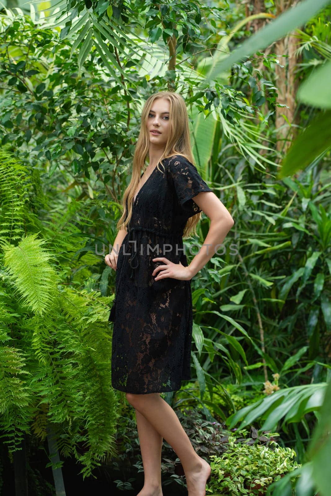 Beautiful young woman wearing summer clothes on tropical resort by OleksandrLipko