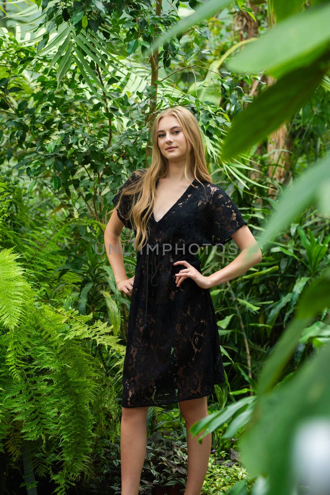 Beautiful young woman wearing summer clothes on tropical resort by OleksandrLipko