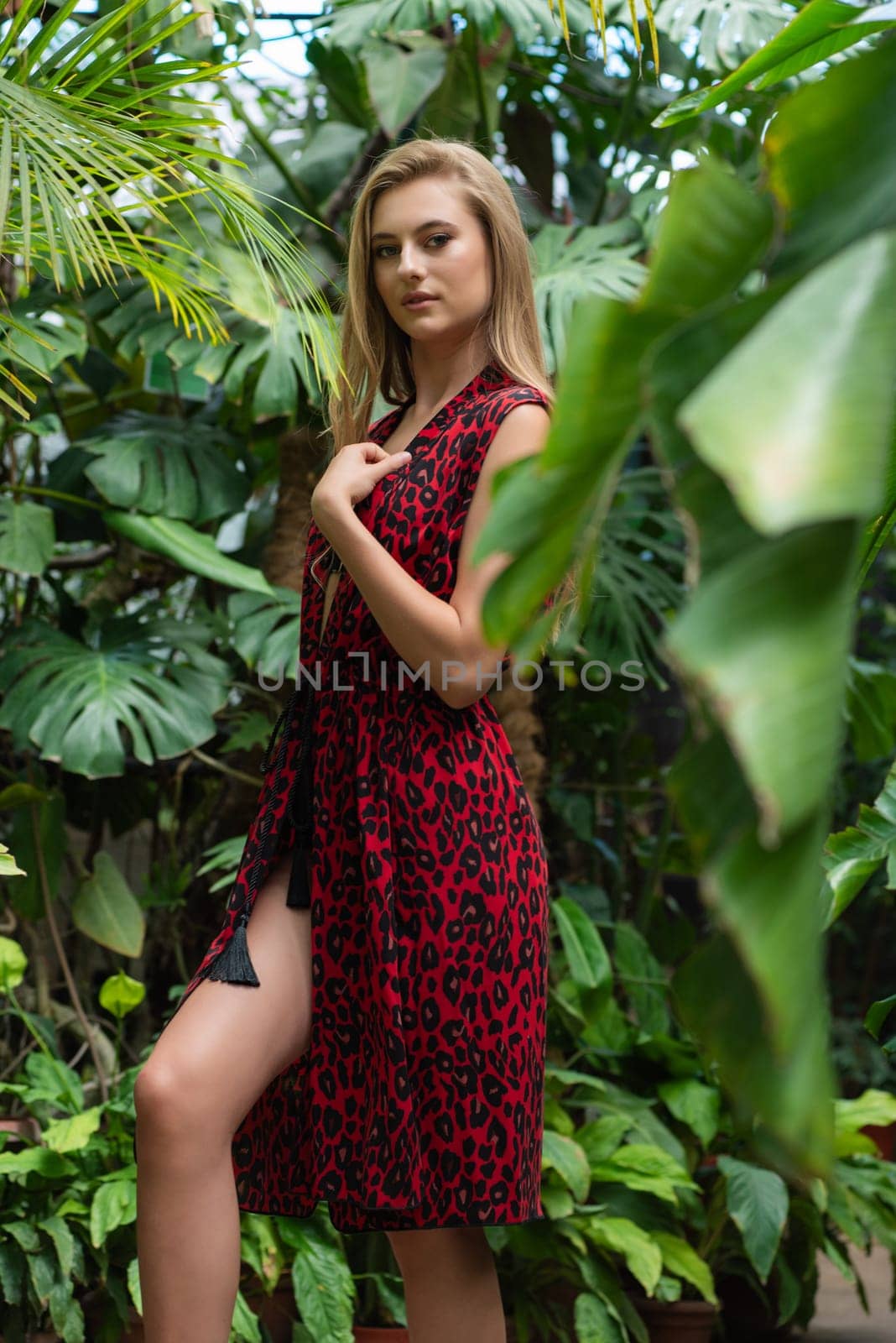 Beautiful young woman wearing summer clothes on tropical resort by OleksandrLipko