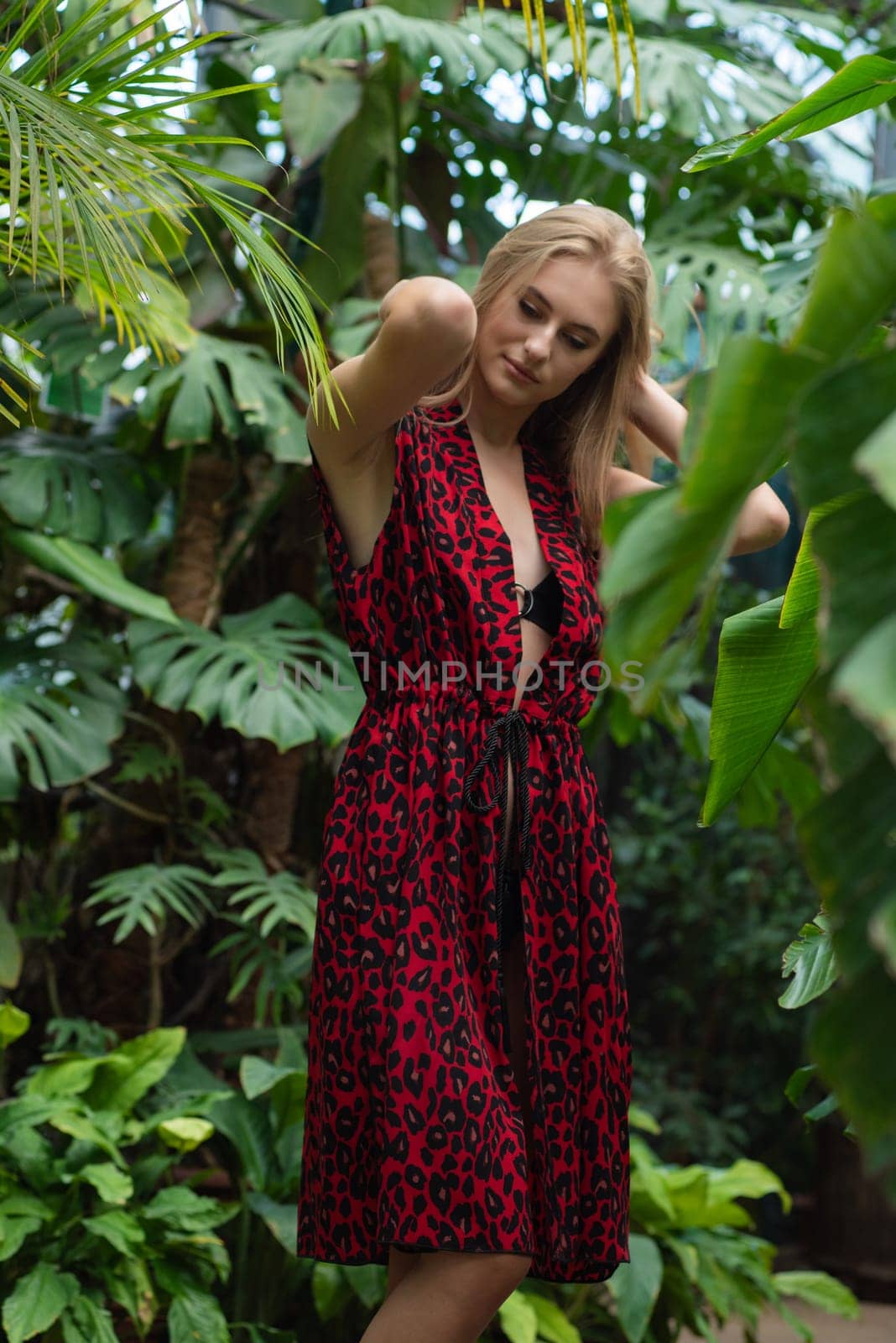 Beautiful young woman wearing summer clothes on tropical resort by OleksandrLipko