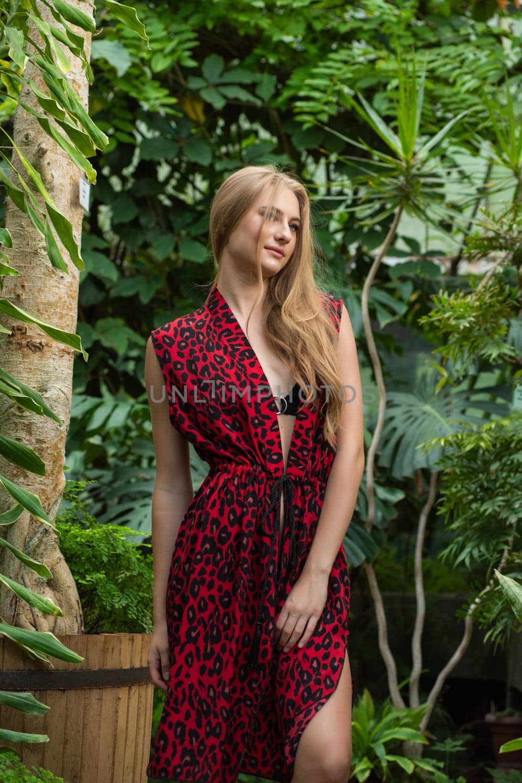 Beautiful young woman wearing summer clothes on tropical resort by OleksandrLipko