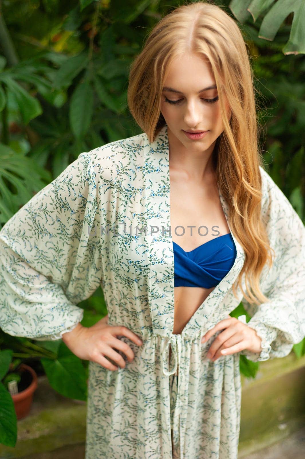 Beautiful young woman wearing summer clothes on tropical resort by OleksandrLipko