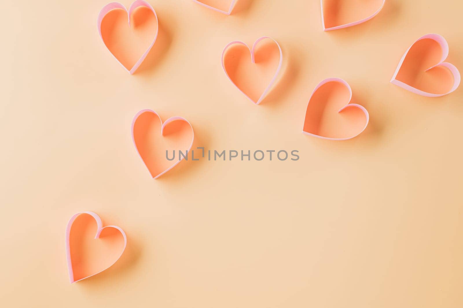Top view flat lay pink ribbon heart shaped decorative symbol on pastel background, love romance concept, template banner design with copy space, Mother, Women's day, Happy Valentines Day