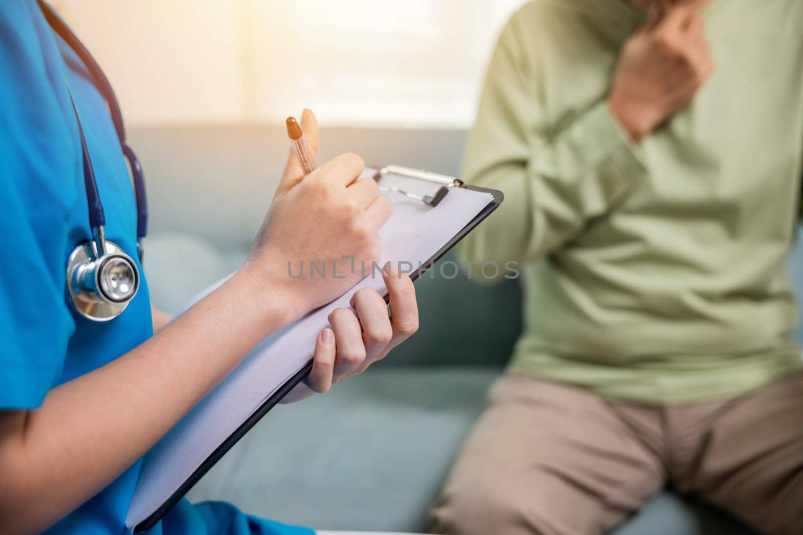 Asian young nurse checking senior man neck pain in clinic at retirement home, doctor woman examines lymph nodes on neck to determine if swollen, sore throat