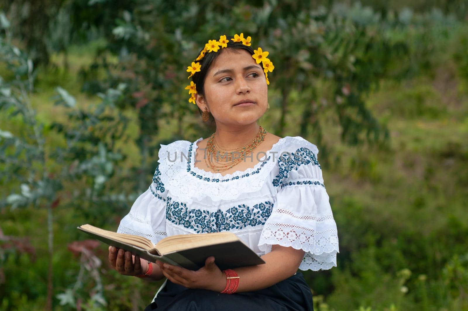 Literary Fiesta: A Woman in Vibrant Mexican Attire Immersed in a World of Words by Raulmartin
