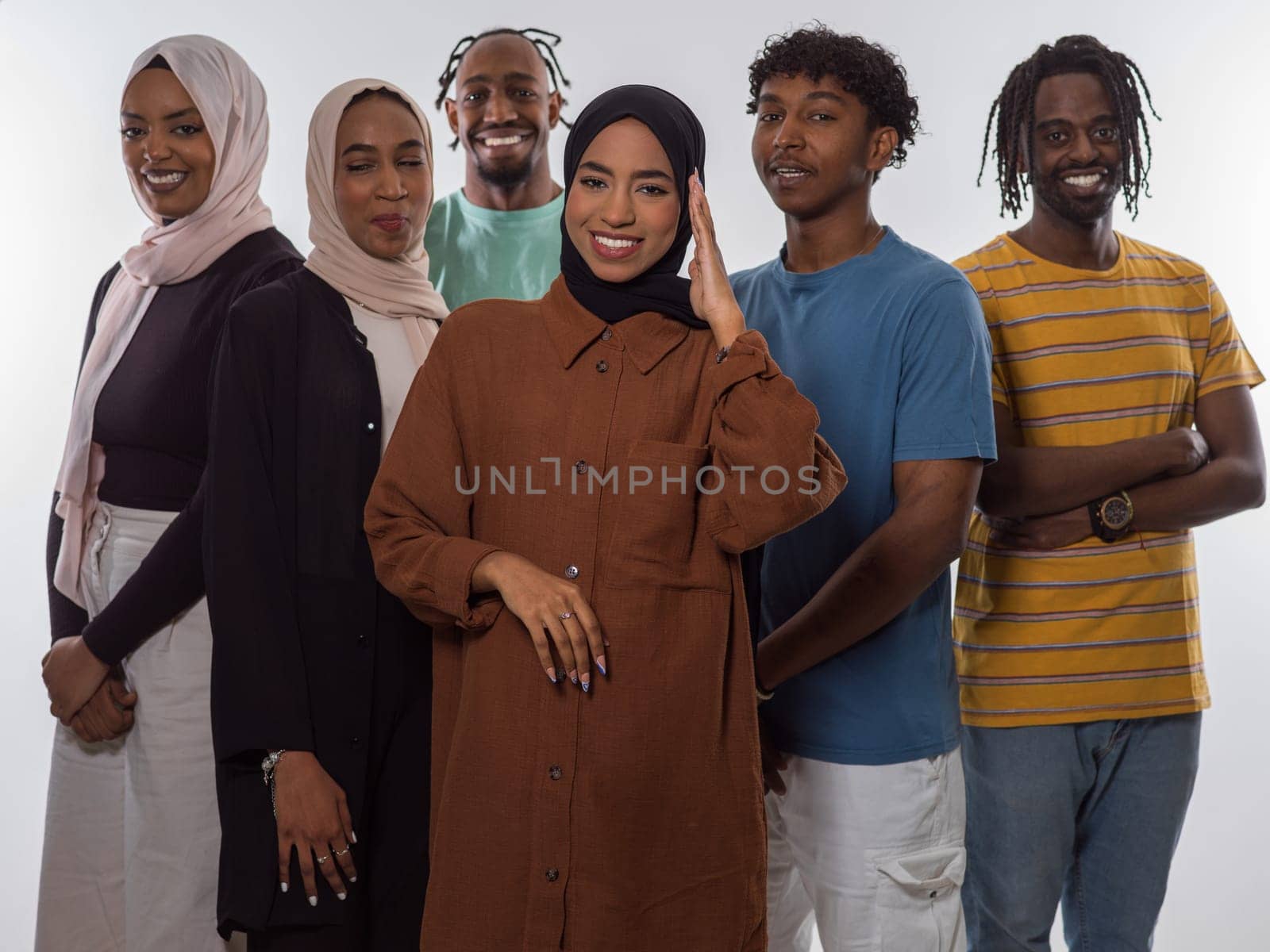 A diverse group of teenagers strikes dynamic poses with smiles and individual styles against a clean white backdrop, portraying the energetic spirit, unity, and varied personalities of modern youth culture.