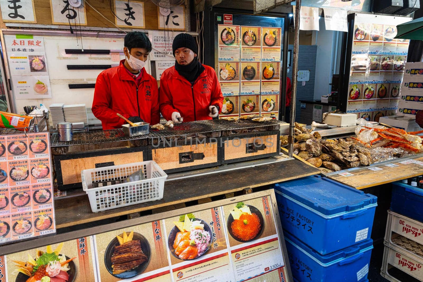 Tokyio, Japan. January 2024. preparing food at stalls at the Tsukiji Outer Market in the city centre