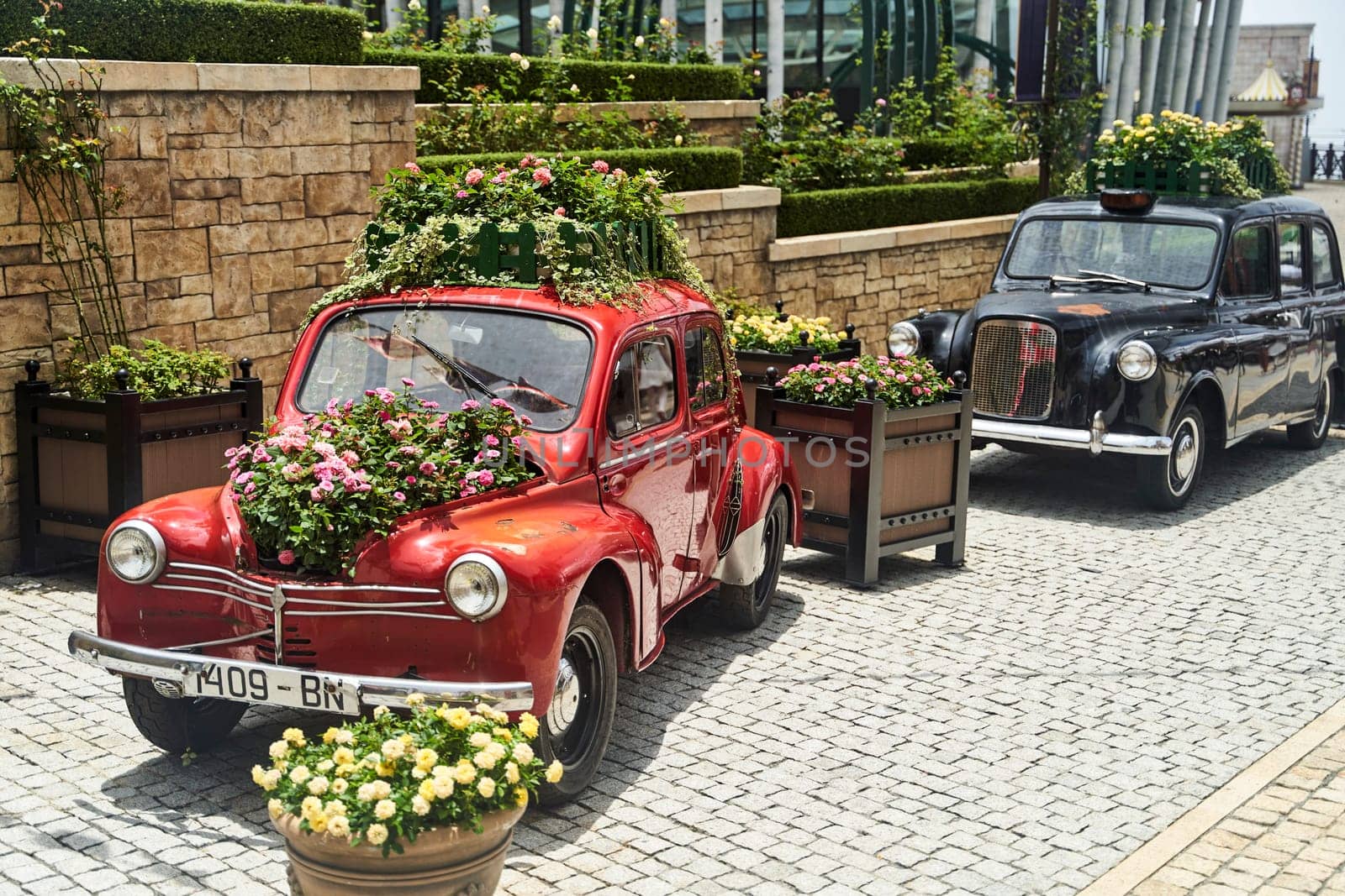 Vintage car decorated with flowers in the photo zone in a romantic style. High quality photo