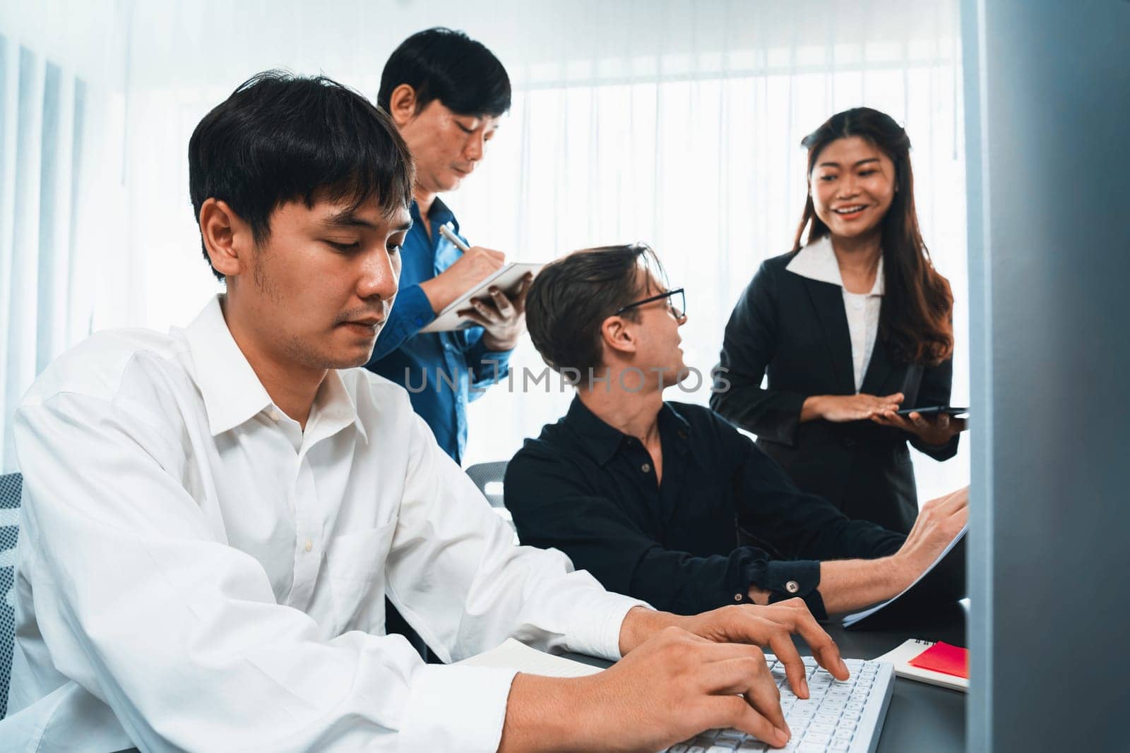 Group of diverse office worker employee working together on strategic business marketing planning in corporate office room. Positive teamwork in business workplace concept. Prudent