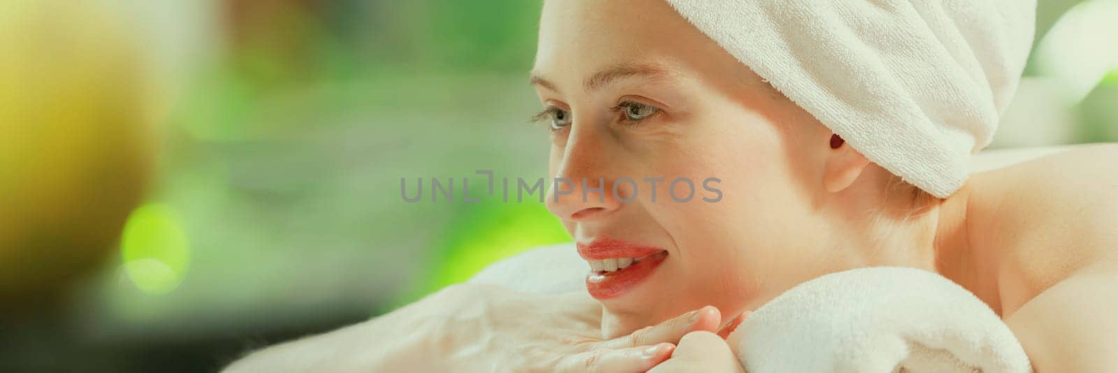 Closeup of beautiful women relaxes on spa bed surrounded by nature.Tranquility by biancoblue