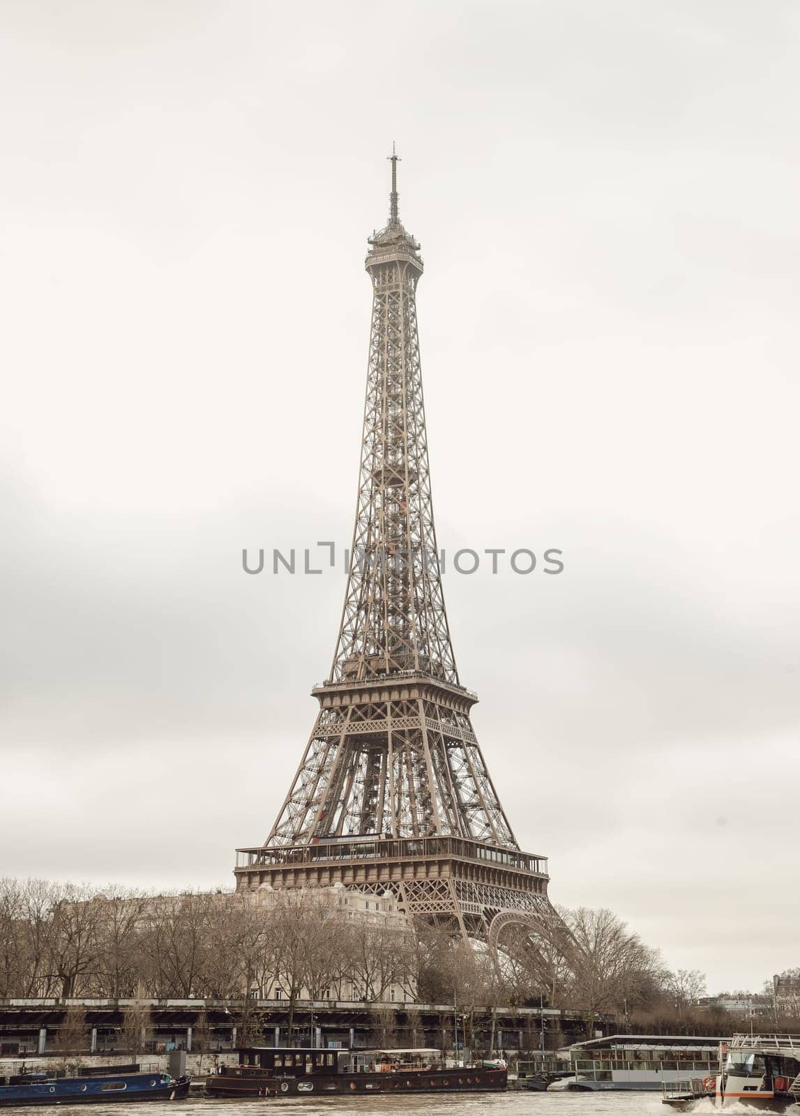 France, Paris - Jan 4, 2024 - Nice scenery of Eiffel Tower and Seine River in Paris at Afternoon. Destinations in Europe. Space for text, Selective focus.