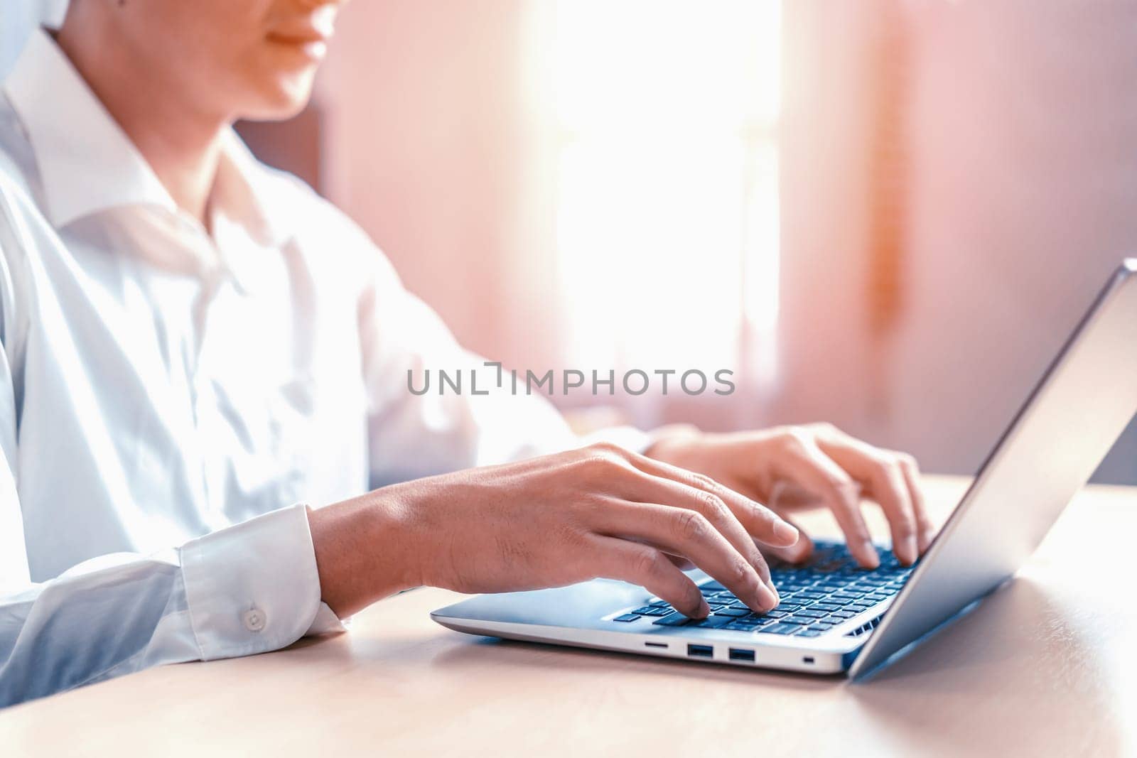 Businessman hand using laptop computer in office. uds by biancoblue