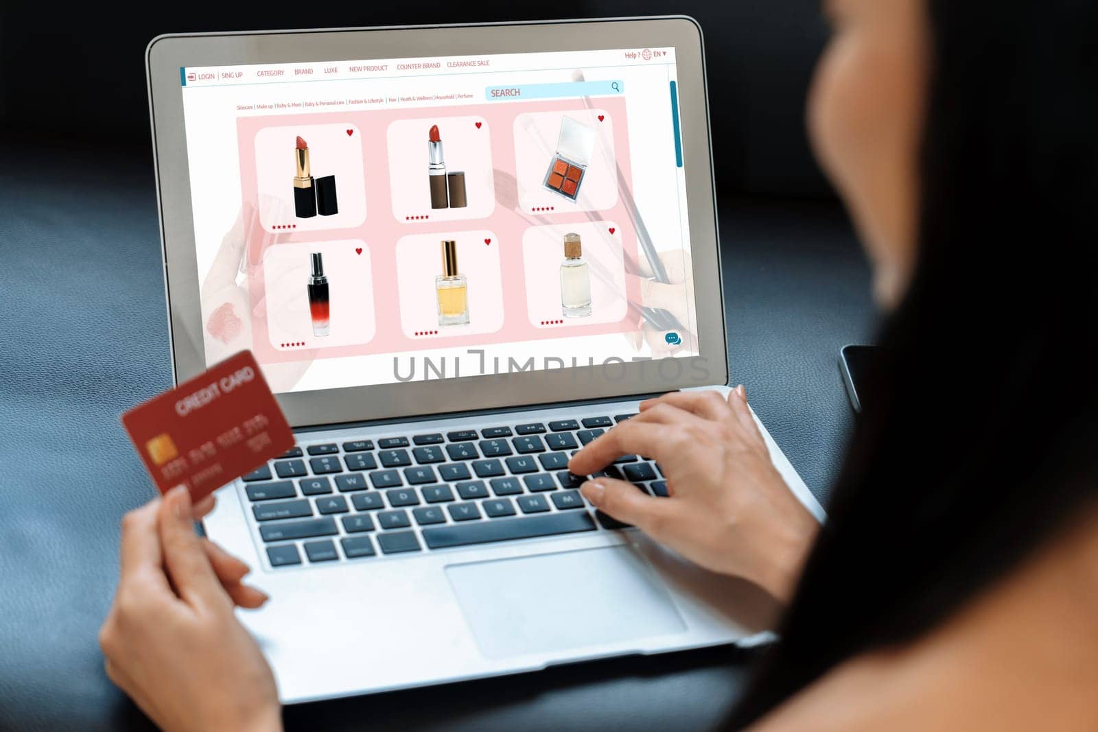 Young woman using laptop with credit card for internet banking, online shopping E commerce by online payment gateway at home. Modern and convenience online shopping with debit card. Blithe