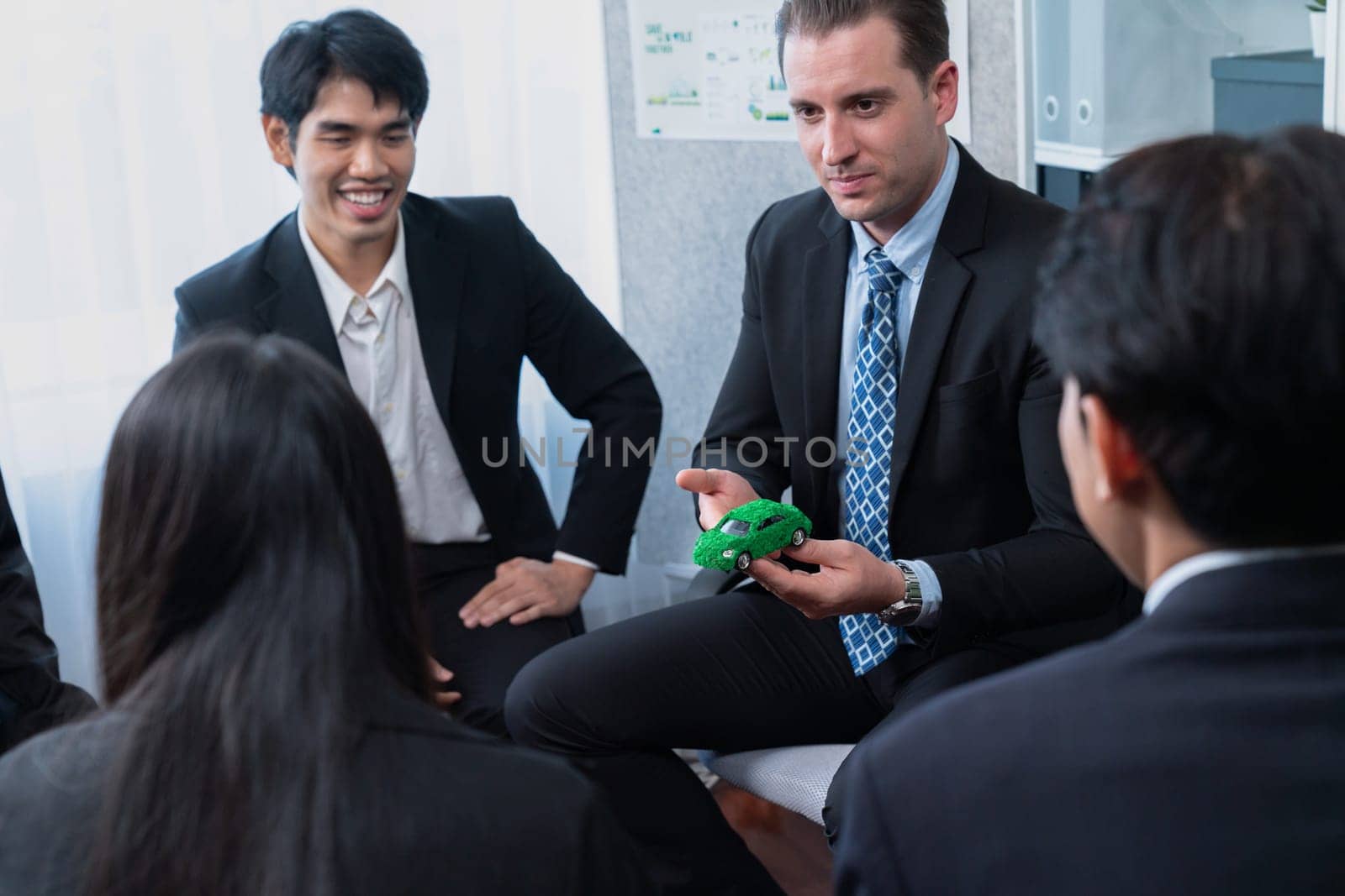 Group of business people discussing strategic marketing in electric car company meeting for eco-friendly EV car using sustainable and alternative power contribute to greener future. Quaint