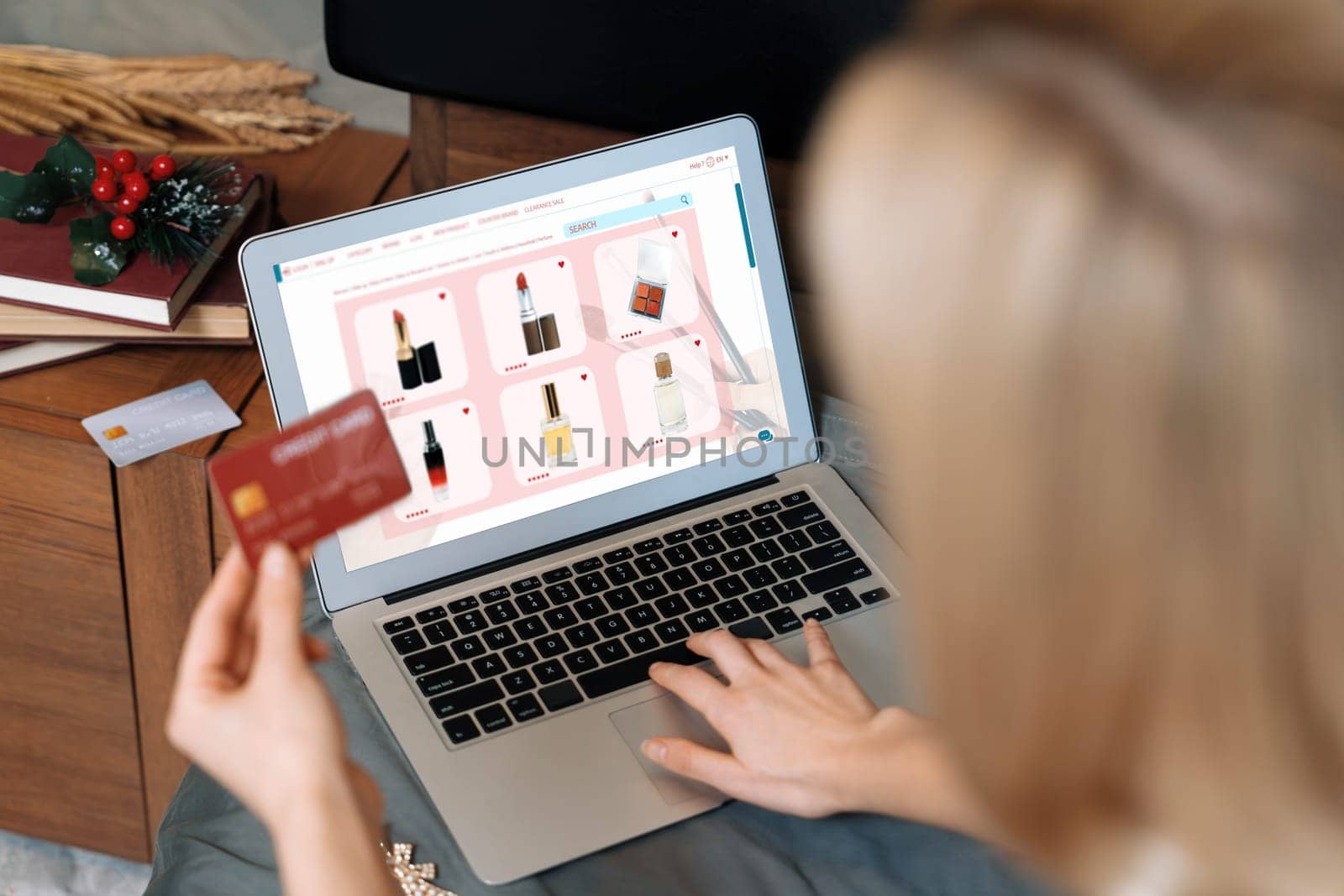 Young woman using laptop with credit card for internet banking, online shopping E commerce by online payment gateway at home. Modern and convenience online shopping with debit card. Blithe