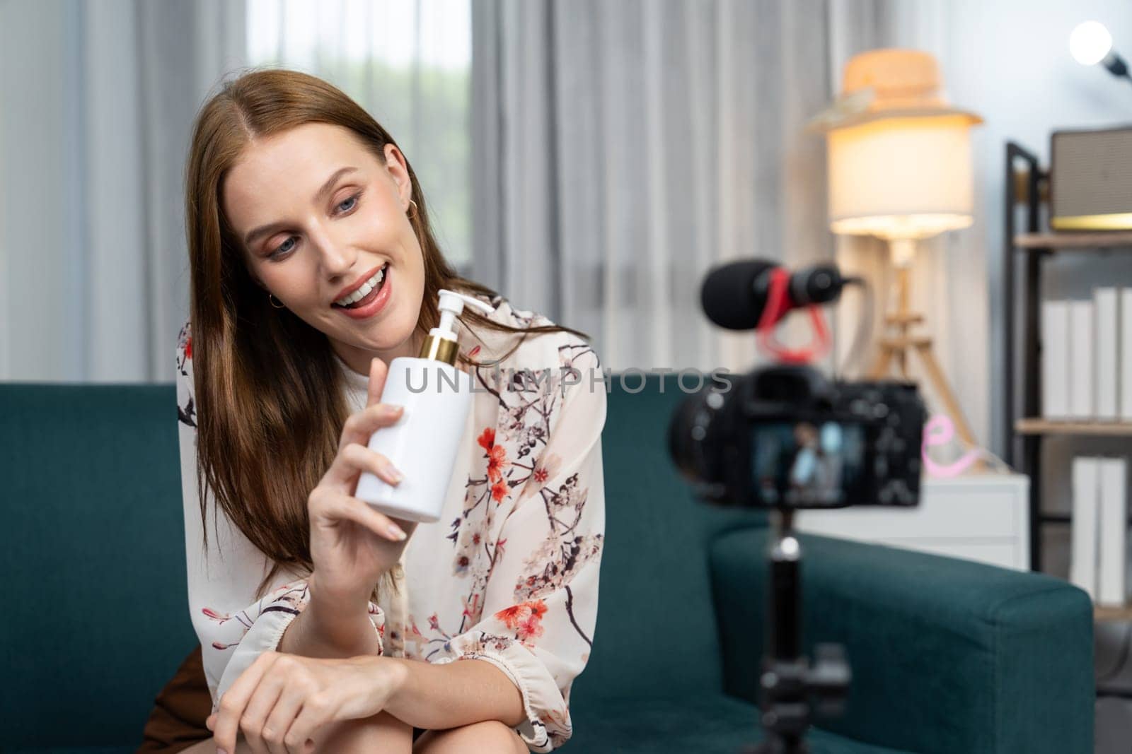 Woman influencer shoot live streaming vlog video review makeup utmost social media or blog. Happy young girl with cosmetics studio lighting for marketing recording session broadcasting online.