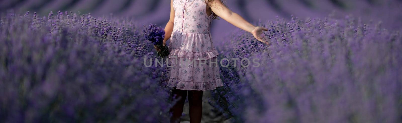 Lavender field girl. happy girl in pink dress in a lilac field of lavender. Aromatherapy concept, lavender oil, photo session in lavender.